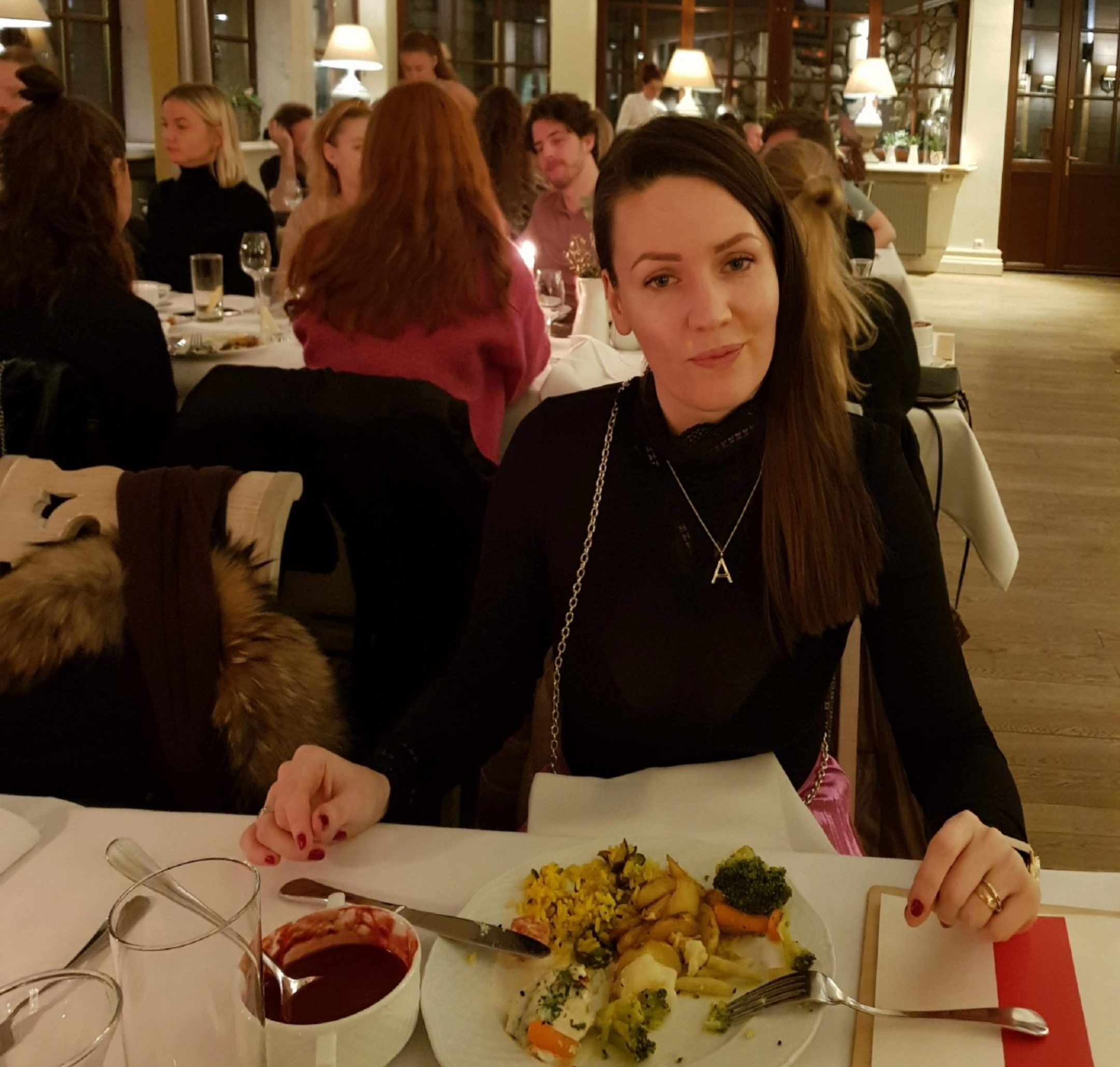 Lady eating in a restaurant